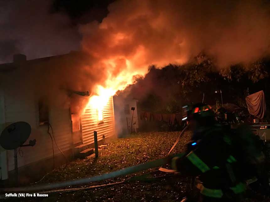 Flames shoot from home as firefighters work in Suffolk, VA