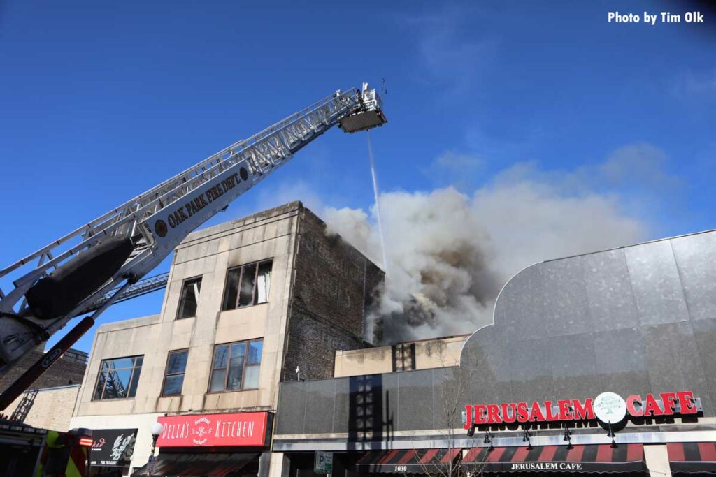 Tower ladder with master stream at Oak Park fire