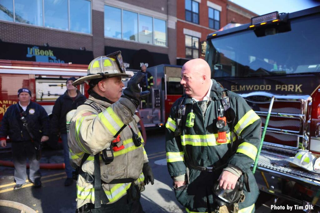 Command staff and firefighters at fire