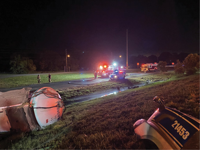 Crews operating on the service road on the low side of the incident encounter a vapor cloud blanketing the area. What was initially thought to be standing water turned out to be gasoline.