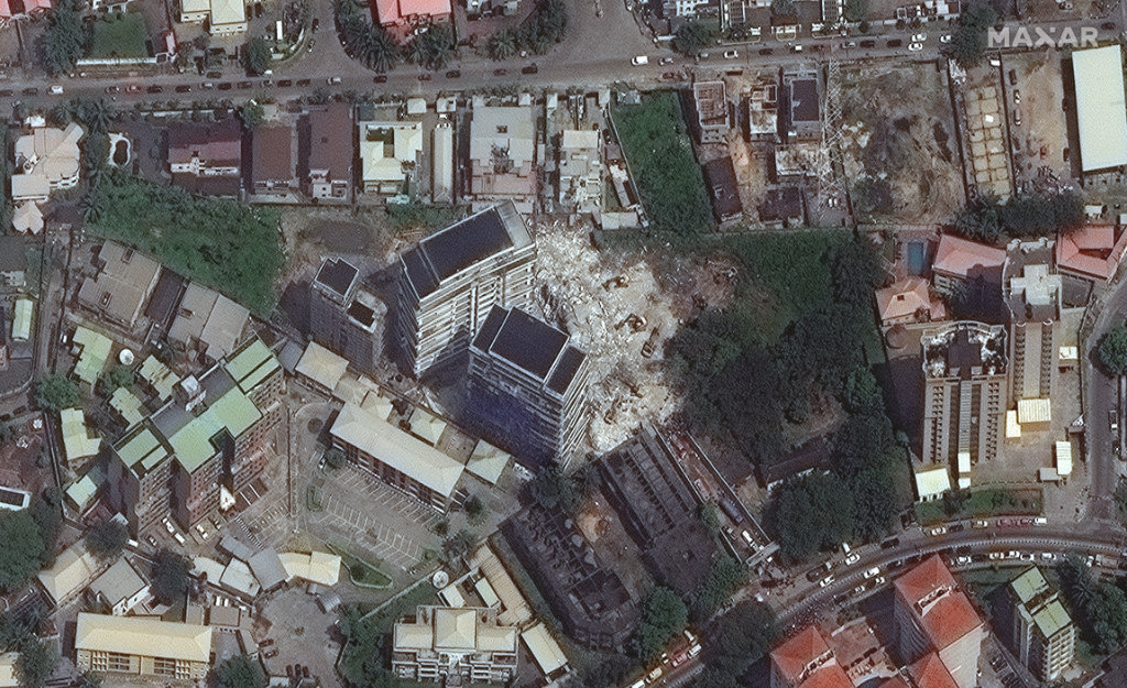 This satellite image provided by Maxar Technologies shows the close up of a collapsed building.