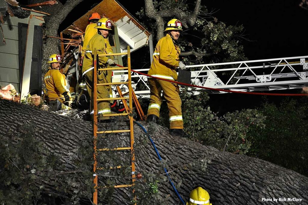 Firefighters with ground ladder and aerial ladder