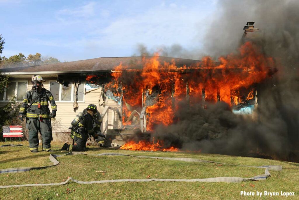 Flames shooting from front of home