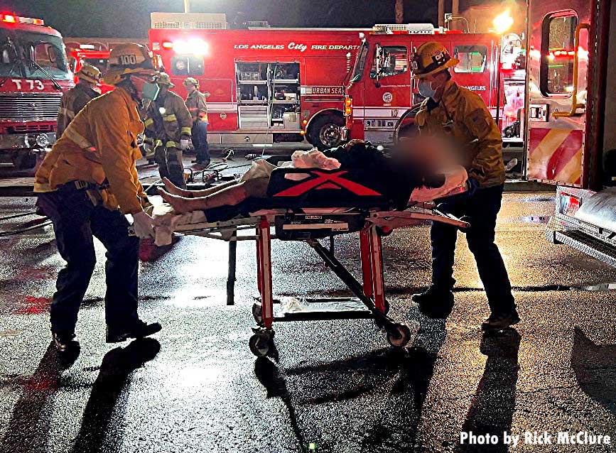 LAFD firefighters transport victim extricated from vehicle