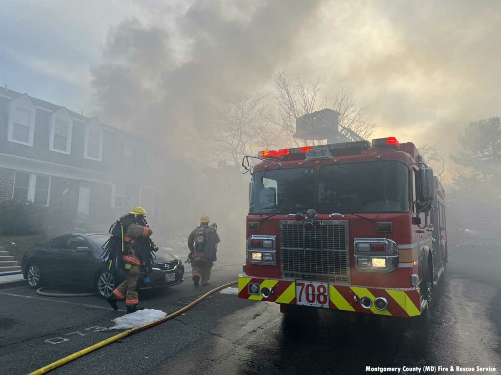 Montgomery County firefighters work at the scene of a fire in Gaithersburg, Maryland