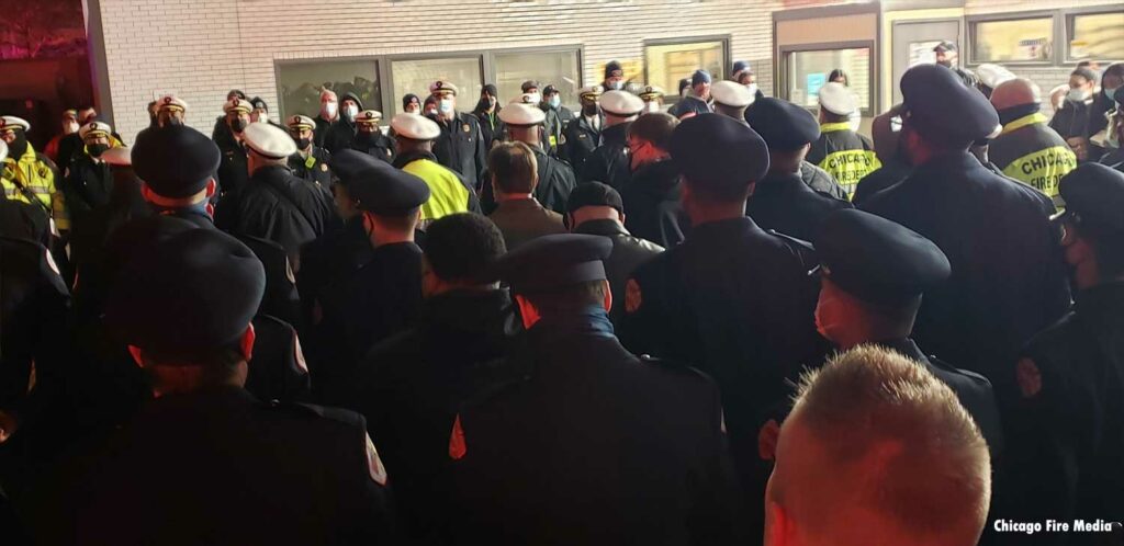 Chicago firefighters watch outside hospital