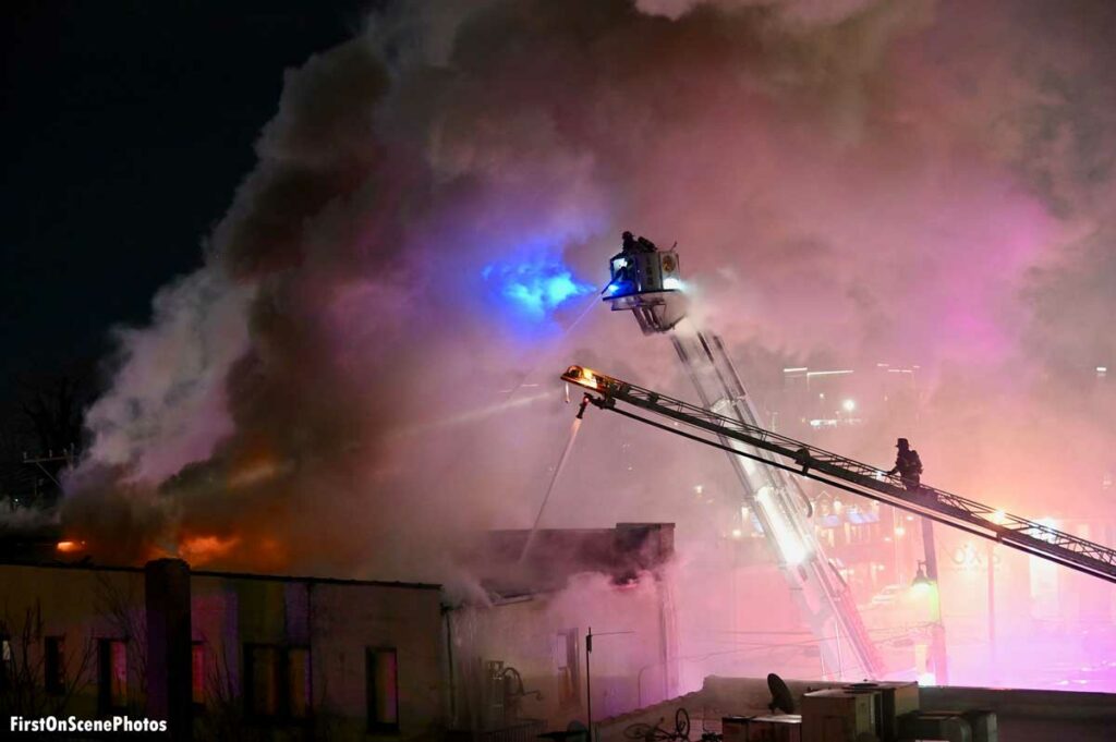 Firefighters battle a Mineola commercial fire