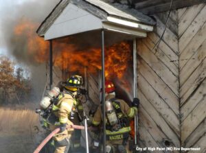 High Point NC firefighters conduct live fire training at an acquired structure.