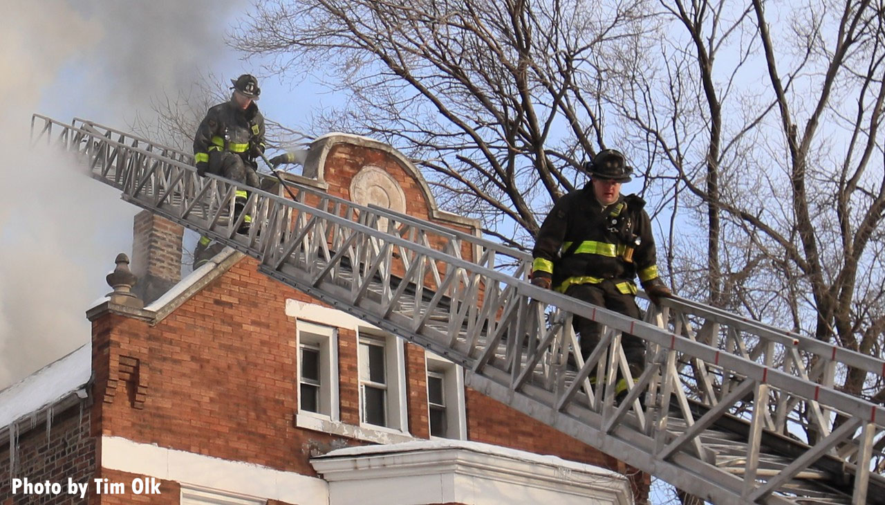 Chicago firefighters descend aerial ladder