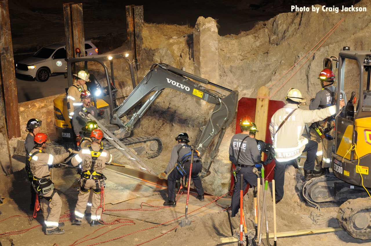 Firefighters and mini excavators at rescue in Florida