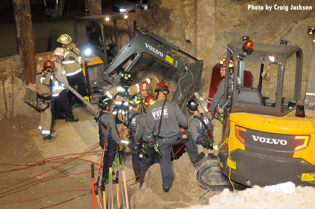 mini excavators and firefighters at trench rescue