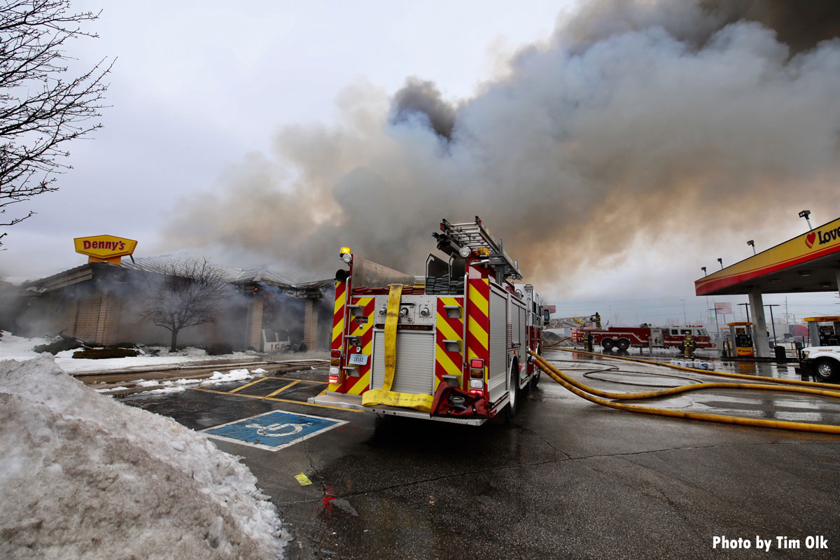 Smoke and fire trucks at Denny's fire in Gary