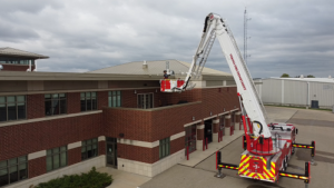 Crane holding fireman