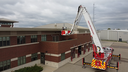 Crane holding fireman