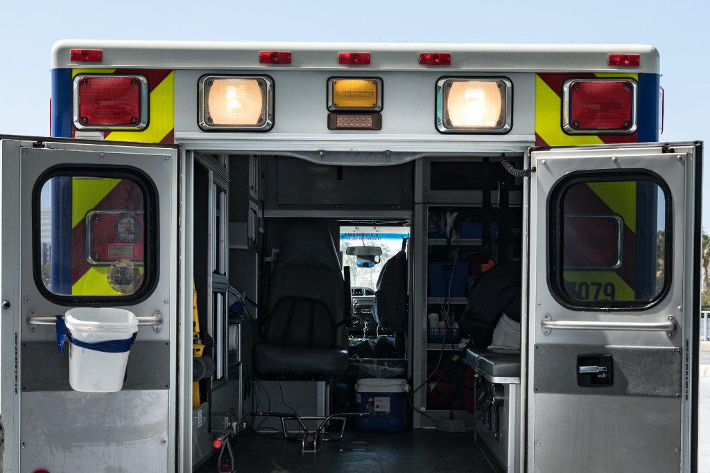 An ambulance with its rear doors open.