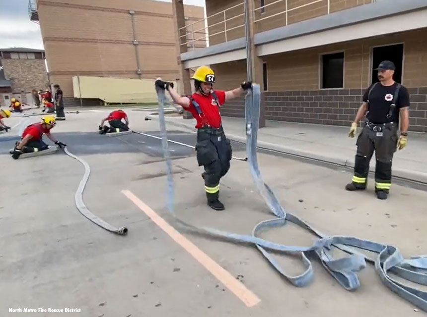 Firefighter flakes out a hose