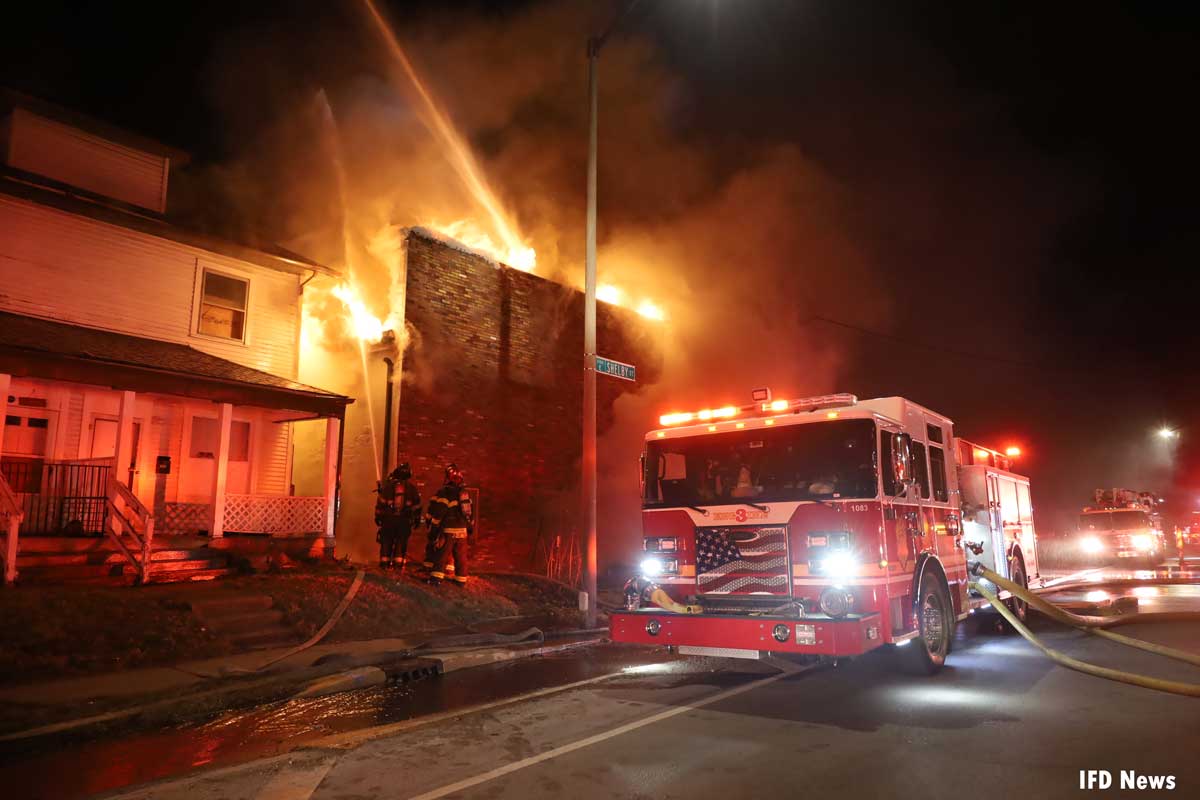 Flames rip through building as Indianapolis firefighters protect exposures