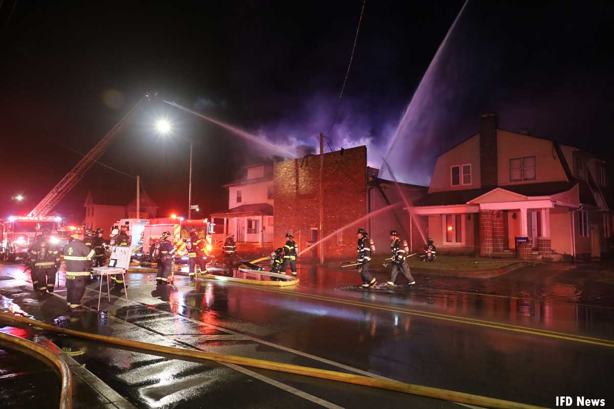 Elevated streams at Indianapolis fire with firefighters and command post