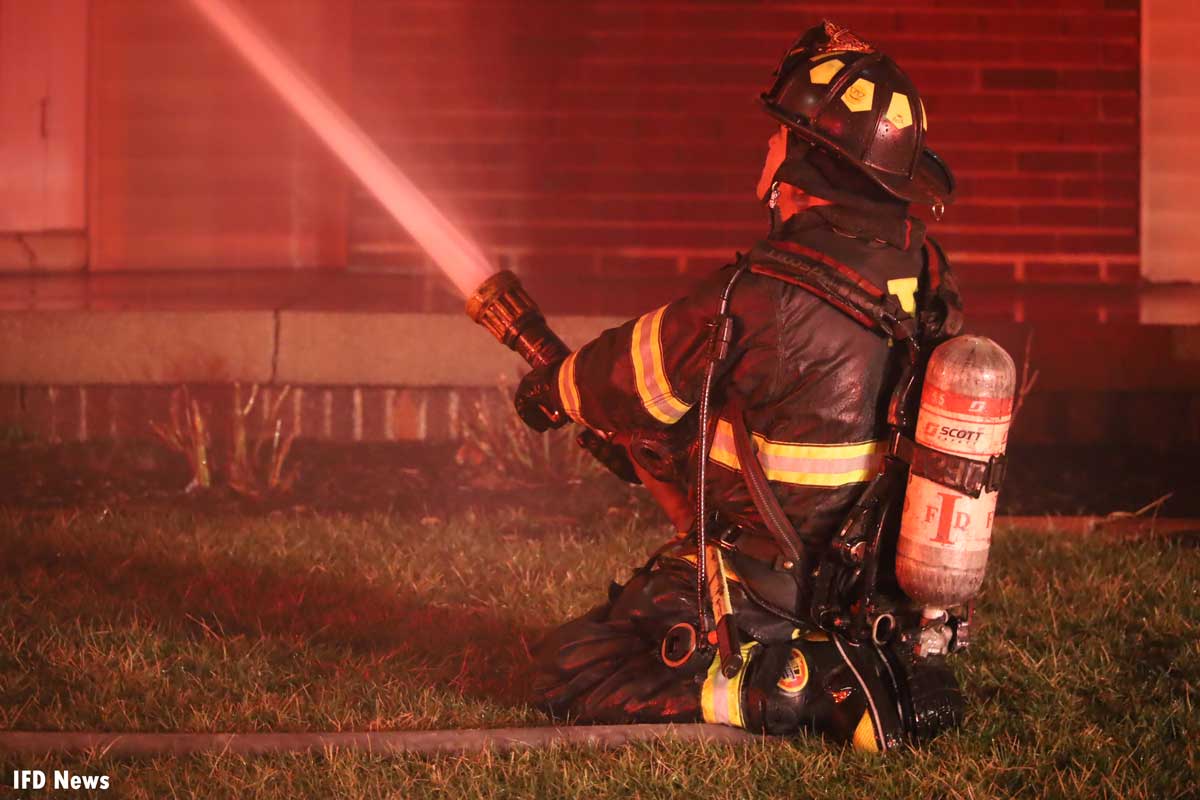 Firefighter on hoseline at Indianapolis fire