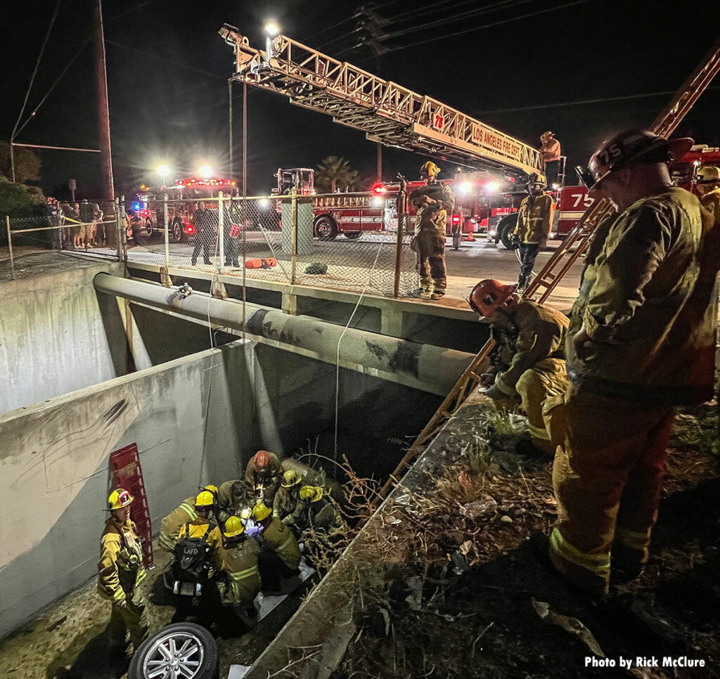 Firefighters work to load patient from extrication in Los Angeles