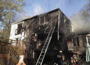 Ladder against fire building