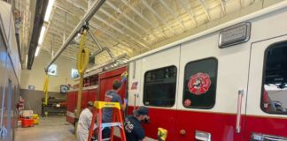 Graham WA firefighters clean a fire truck