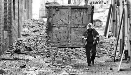 Firefighter with dumpster