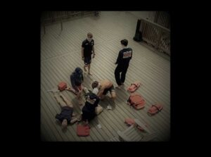 Lifeguards practice resuscitating a drowning victim on a dummy