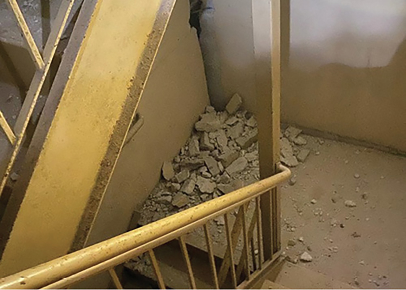 Fallen debris inside of the stairwell that rescuers ascended.