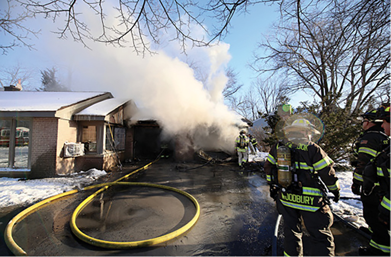 The fire is communicating to the siding on the residential portion of the building. A quick knockdown helps prevent fire from getting into the main house.