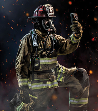 Firefighter in full gear with a TIC