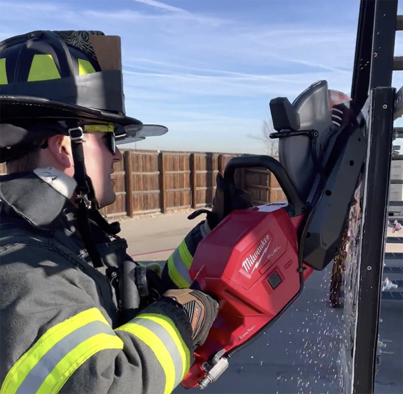 Testing a nine-inch battery saw’s ability to cut drop-bar bolts.