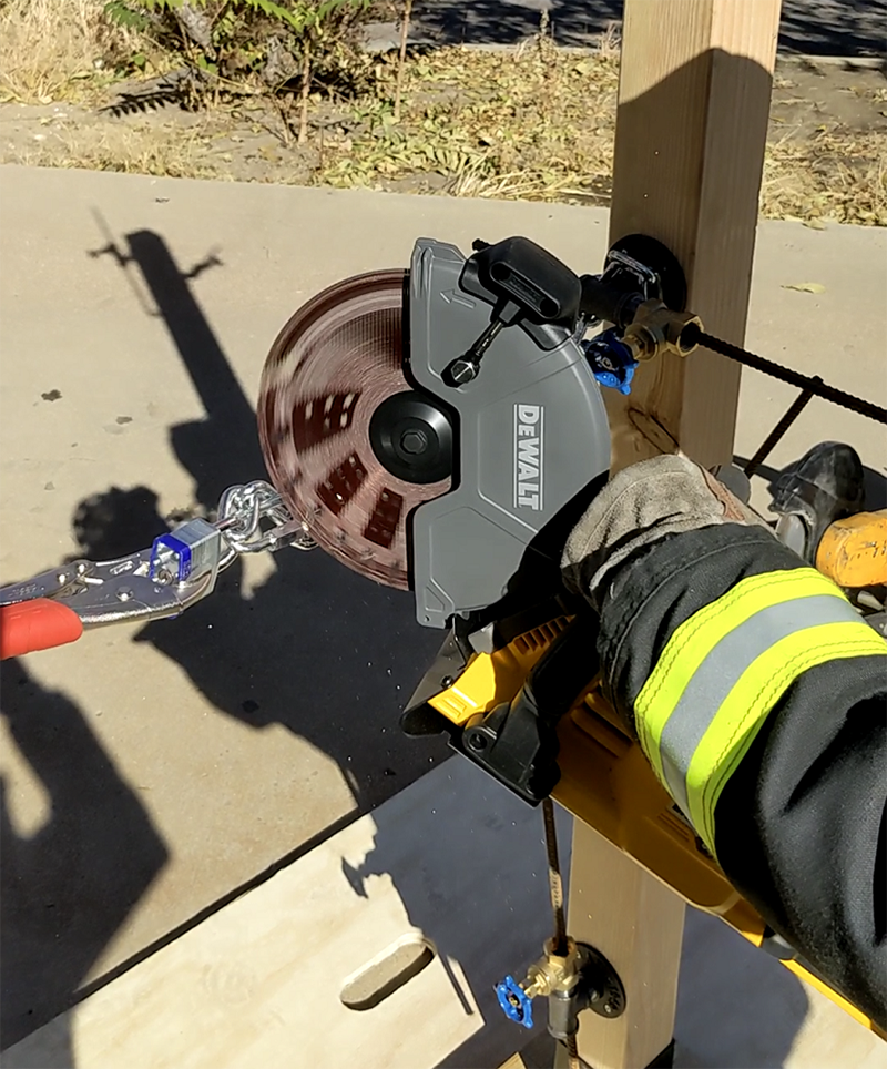 Cutting a 5⁄16-inch chain for product testing.