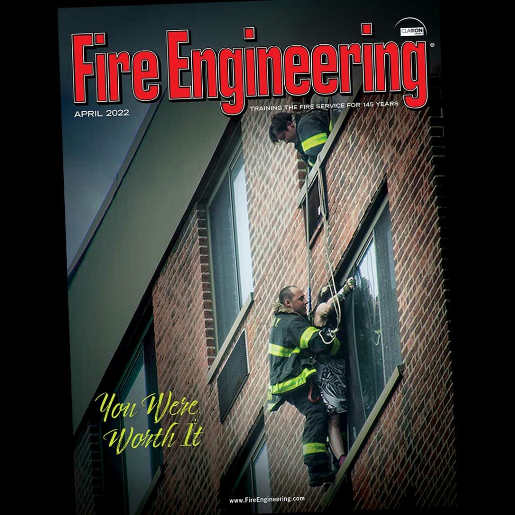 FDNY firefighters on rope rescuing person from building window