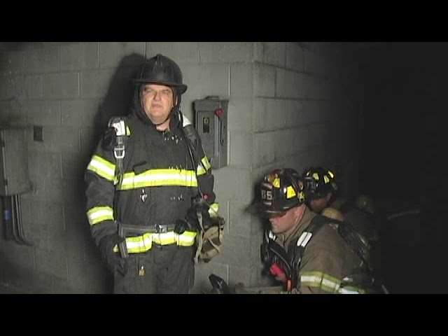 Ray McCormack and firefighter on hoseline handling