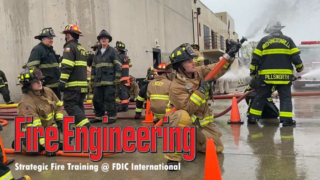 Firefighters advance hoselines at FDIC