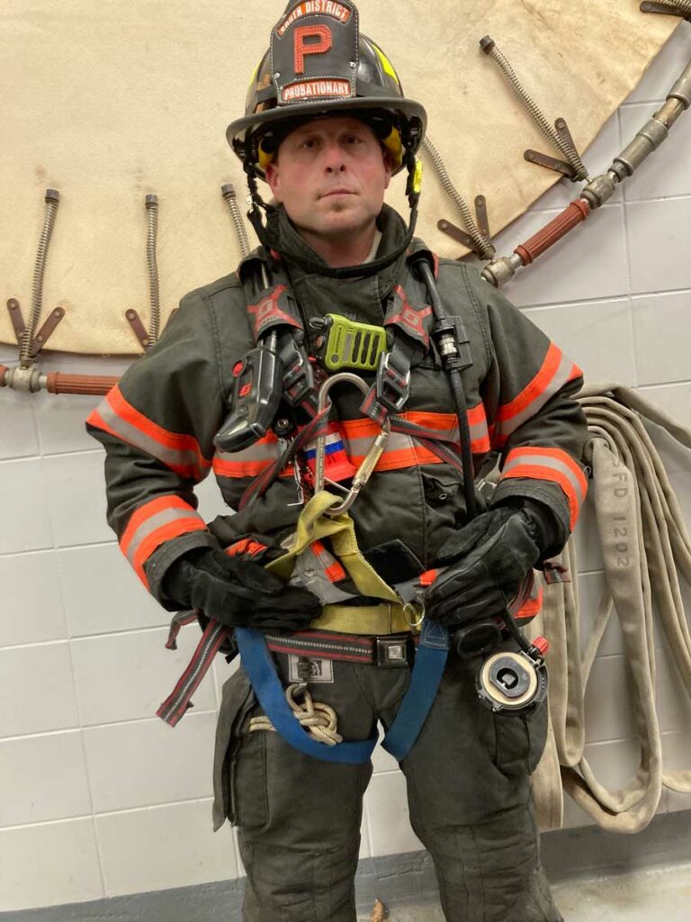 Firefighter demonstrating gear packaging