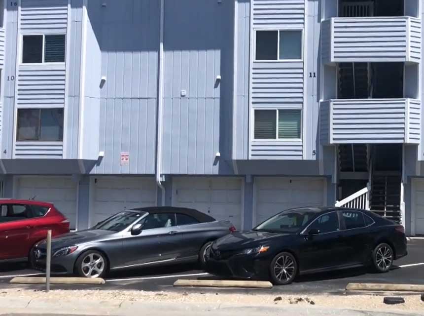 Cars in front of an apartment building