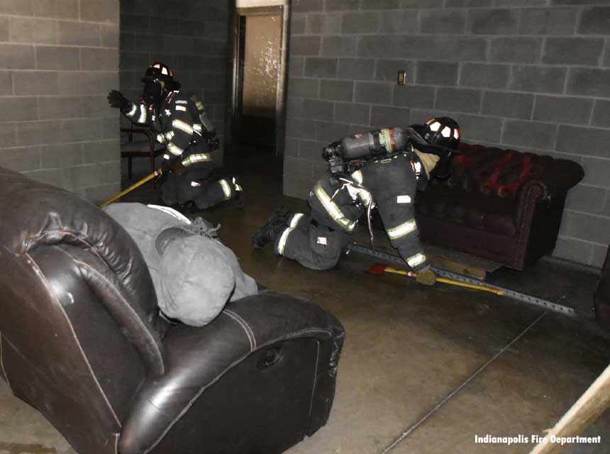 Firefighters perform search training