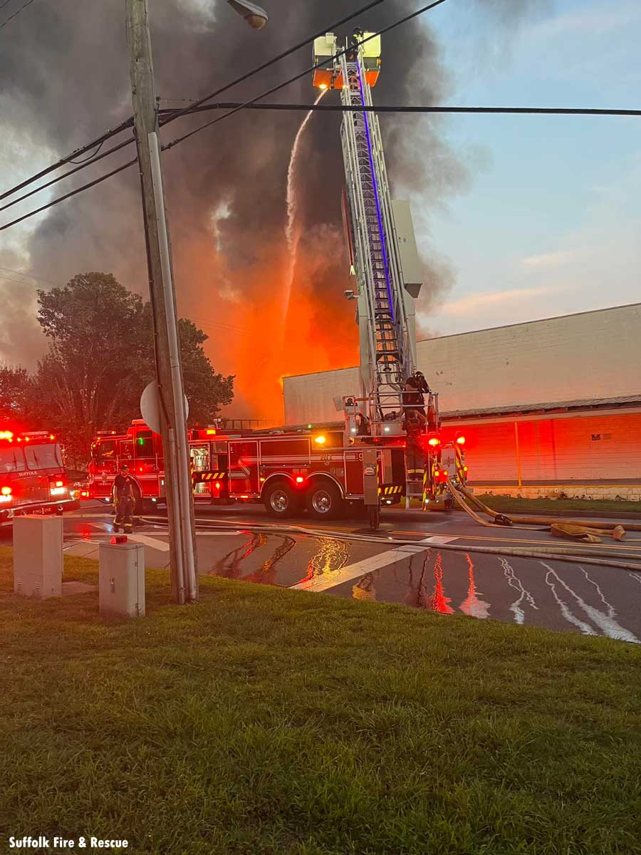 Suffolk VA tower ladder puts water on fire with smoke