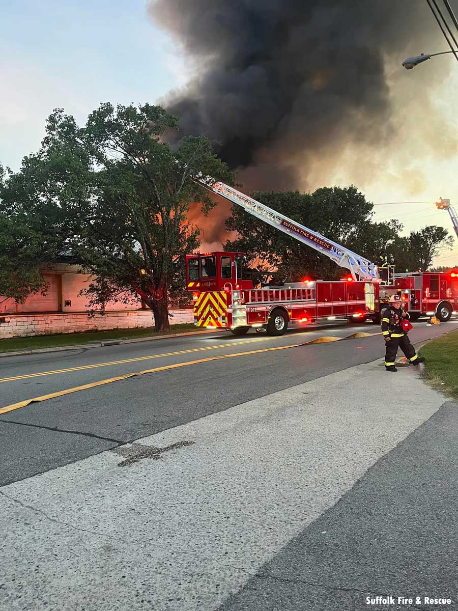 Suffolk VA firefighter and aerial with dark smoke in background