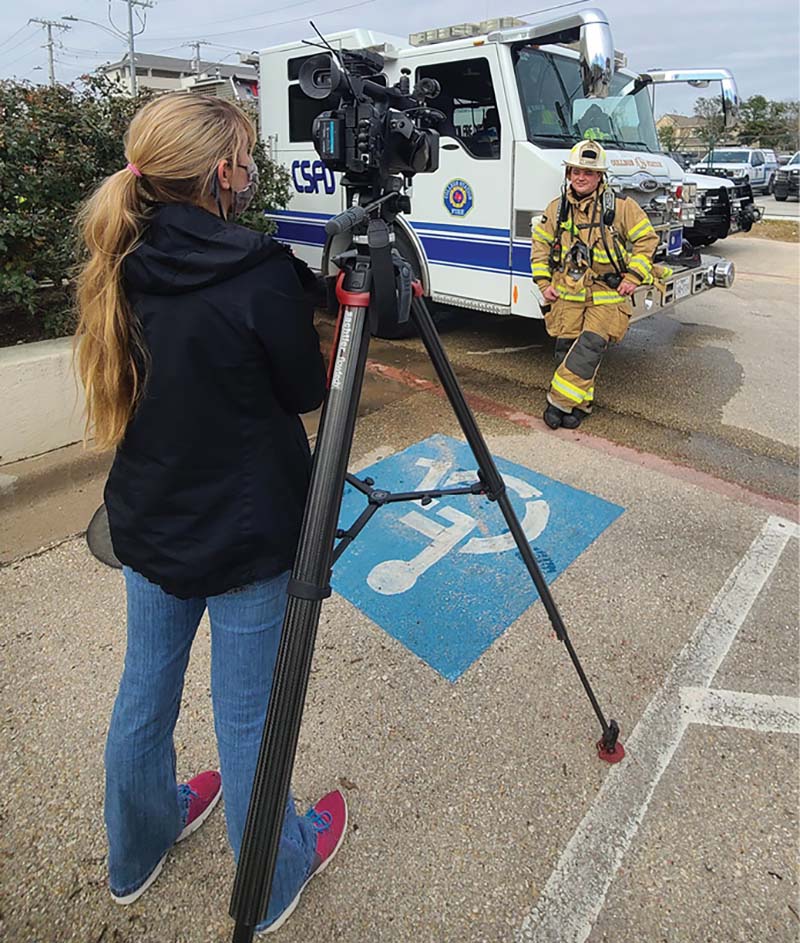 Firefighter interviewed by reporter