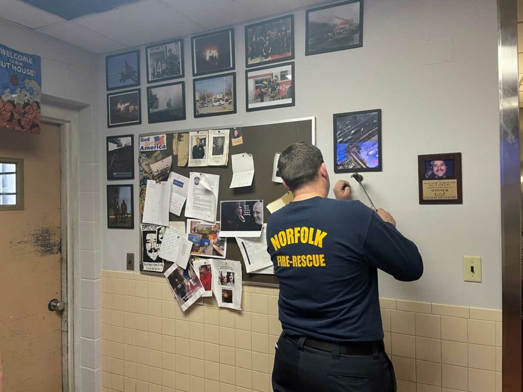 Norfolk fire lieutenant hangs historical mementos in fire station