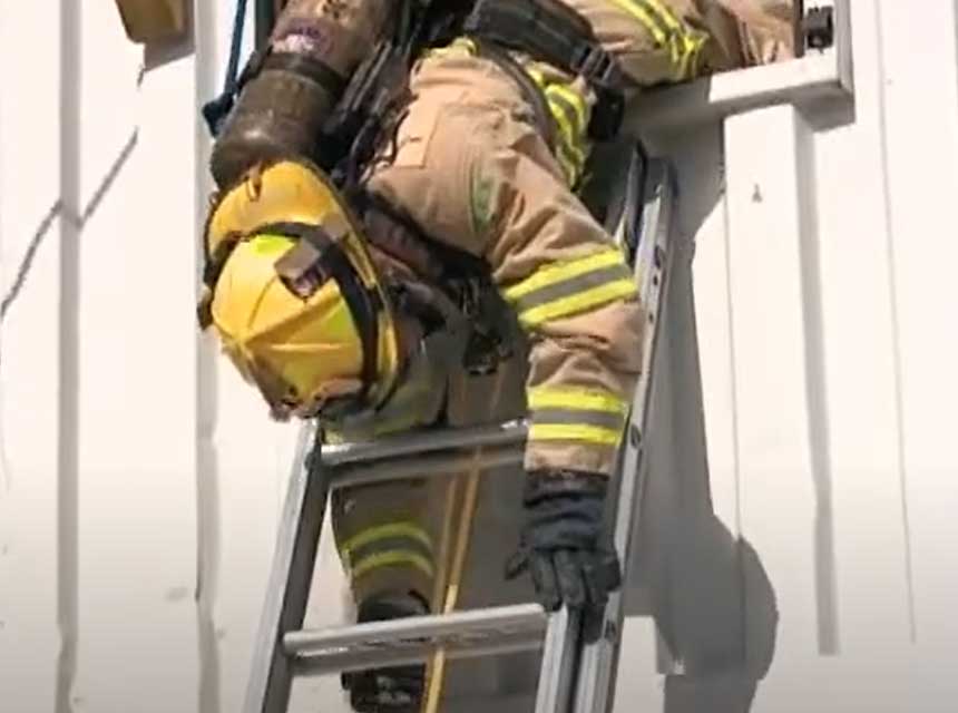 Firefighter bailout headfirst on ladder