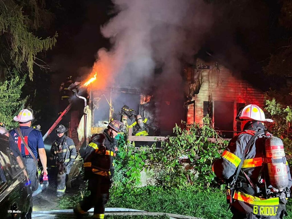 Indianapolis firefighters respond to the scene of a house fire