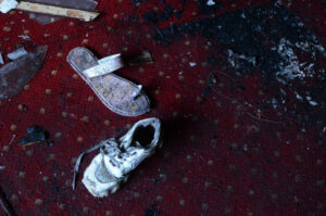 Abandoned shoes remain at the site of a fire inside the Abu Sefein Coptic church that killed at least 40 people and injured some 14 others.