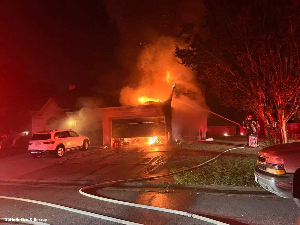 Suffolk Virginia Firefighters train hoseline on duplex fire