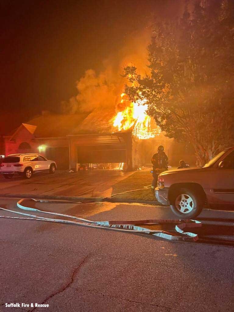 Flames shoot from above garage in Suffolk Virginia