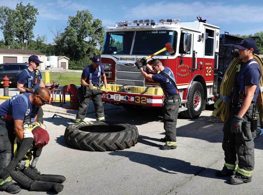 Firefighters doing functional fitness exercises