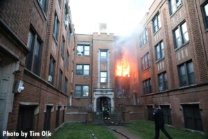 Chicago fire officer and firefighters at apartment fire